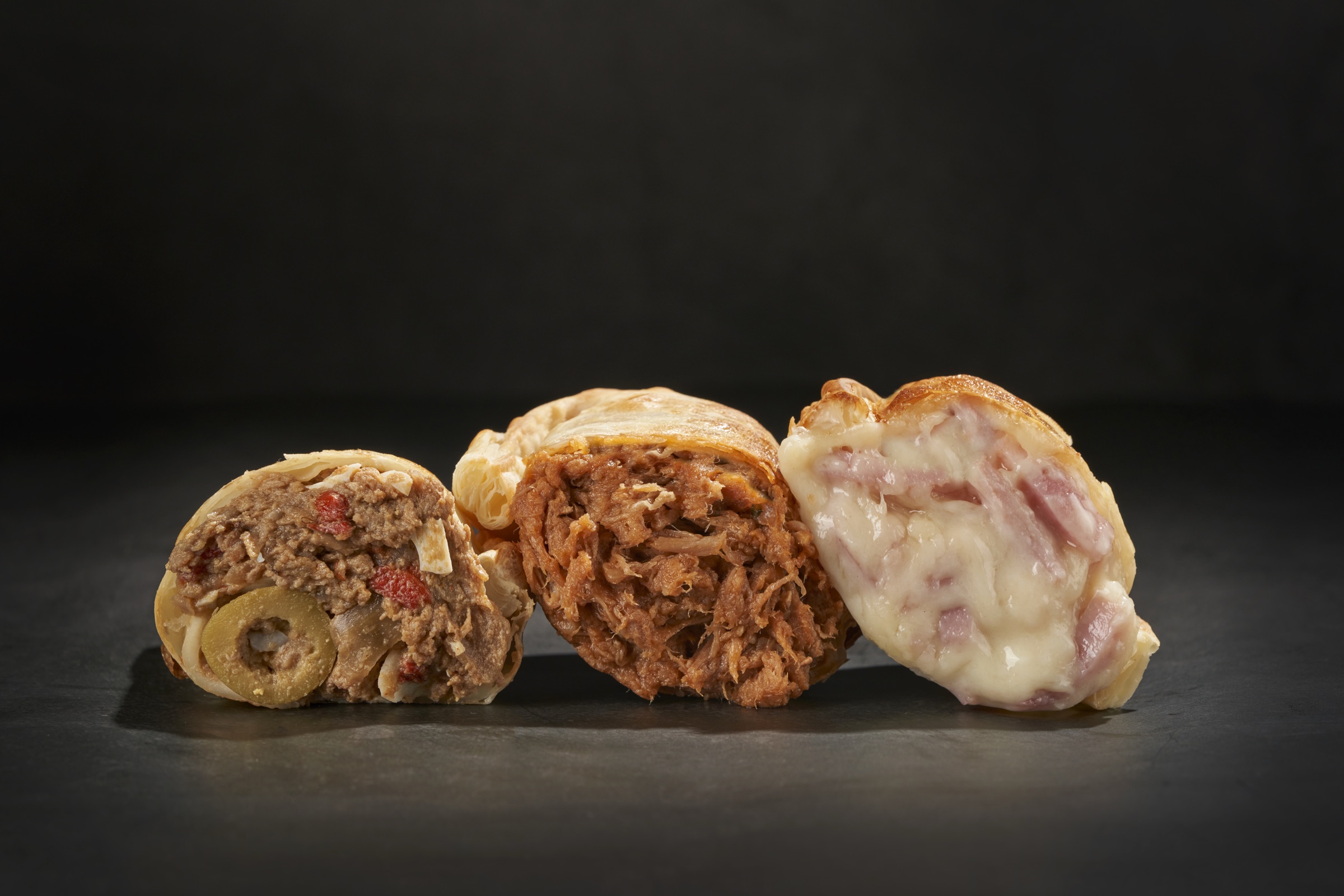 Tres empanadas Malvón en corte